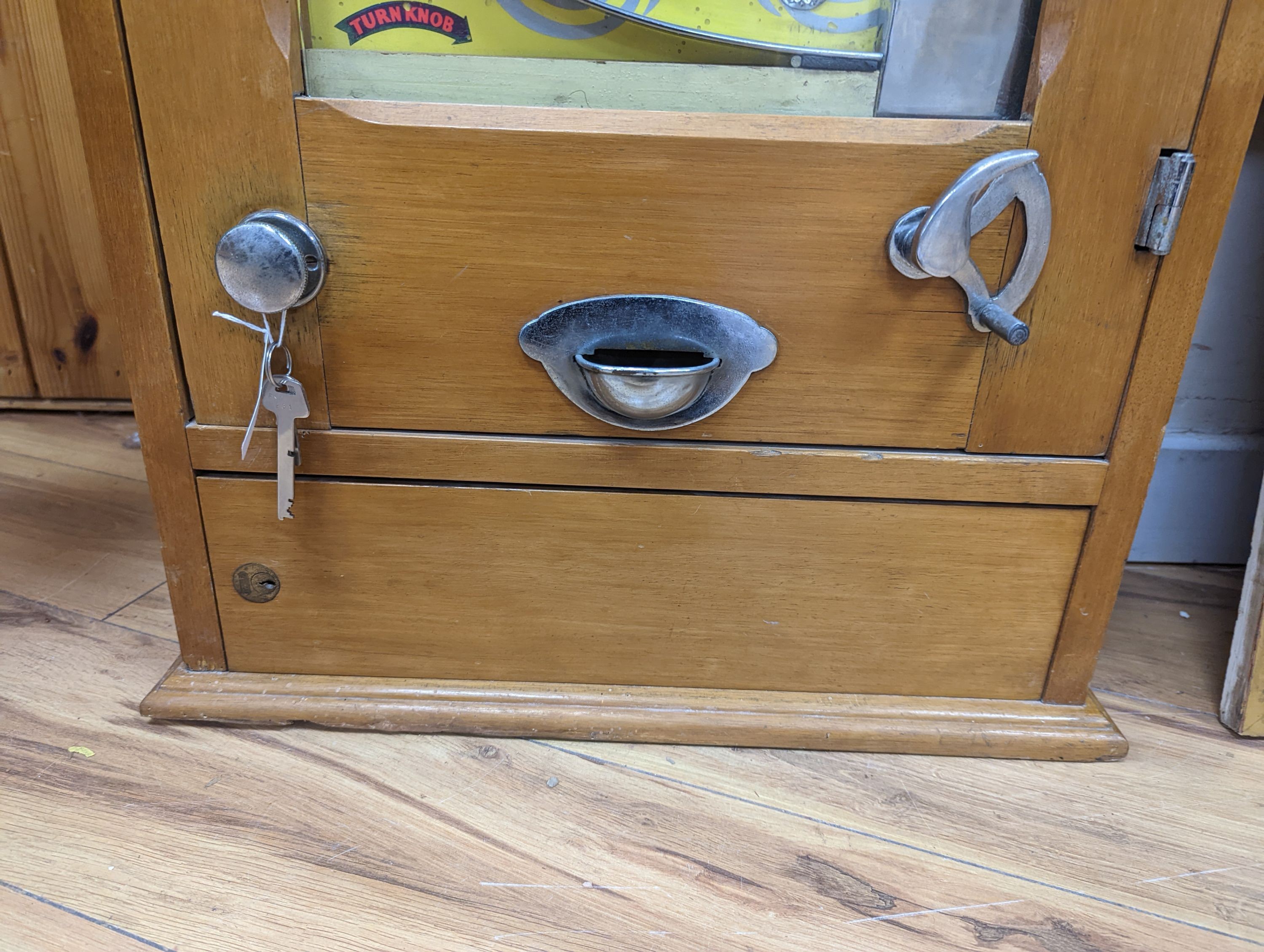An Extrawin coin operated games machine, 87cms high.